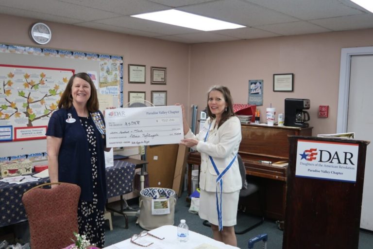 This photo shows the Arizona State Regent receiving a check at a chapter meeting of Paradise Valley Chapter, NSDAR.