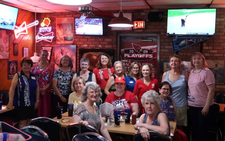 This photo shows members of Paradise Valley Chapter, NSDAR, enjoying a pizza party.